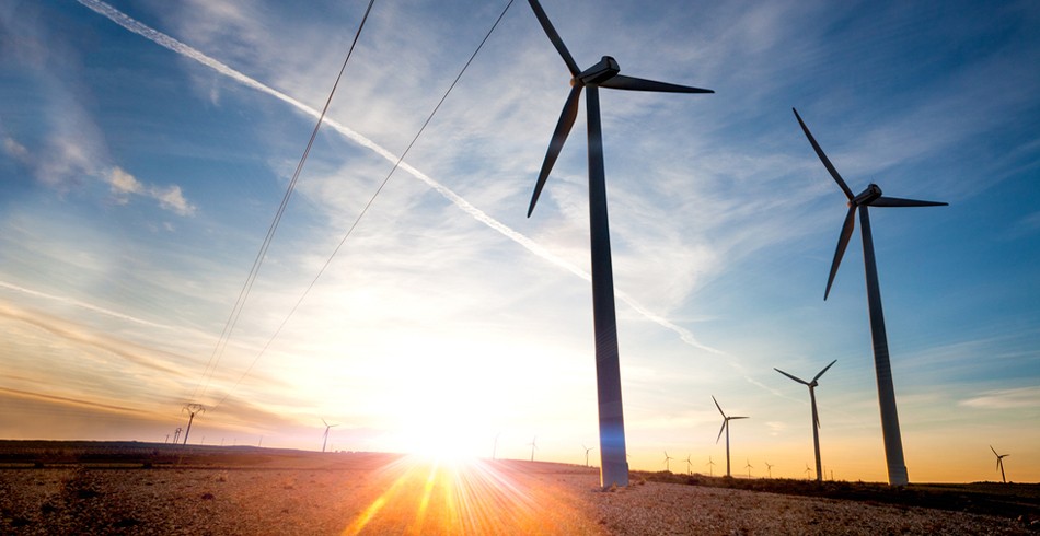 Wind turbines set against beautiful blue sky and sunrise (equinix)