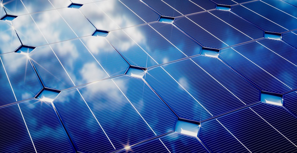 Close up of solar PV modules with clouds reflected on the surface