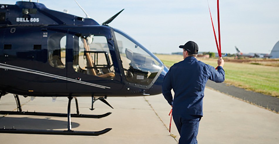 Helicopter pilot prepares for flight (Powercor inspection)