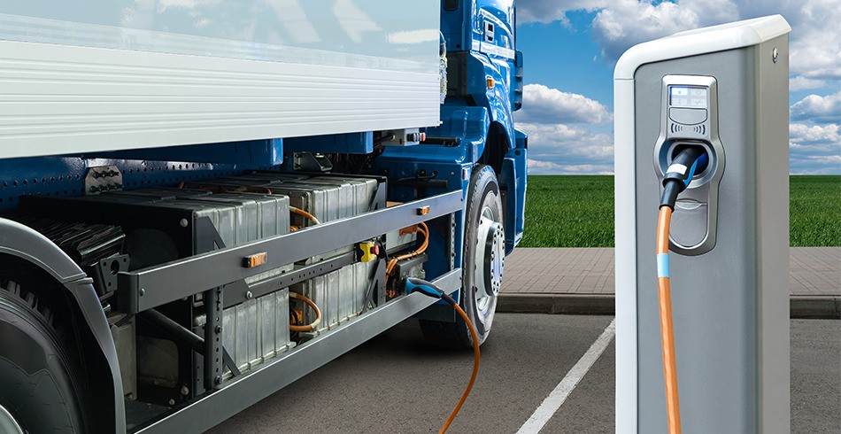 Artist's impression of an electric truck charging at a charging station (heavy vehicle electrification)