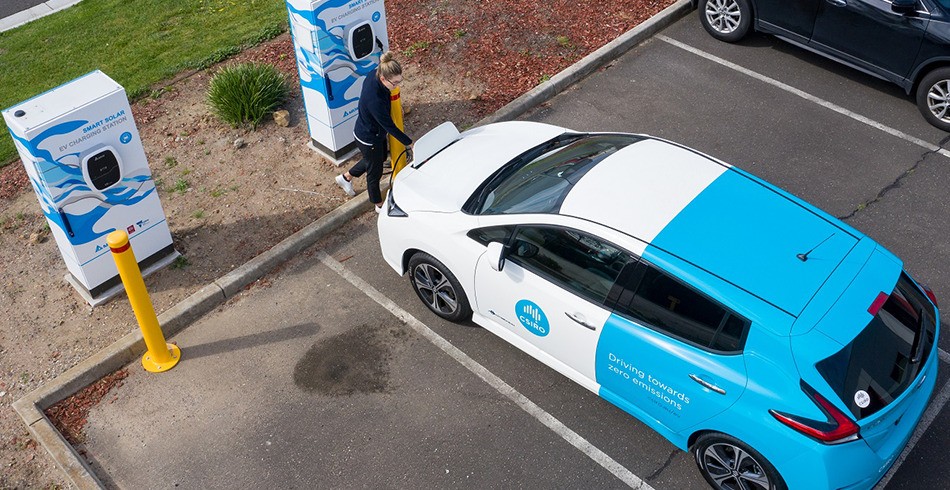 Woman charges EV with CSIRO branding (SMEs)