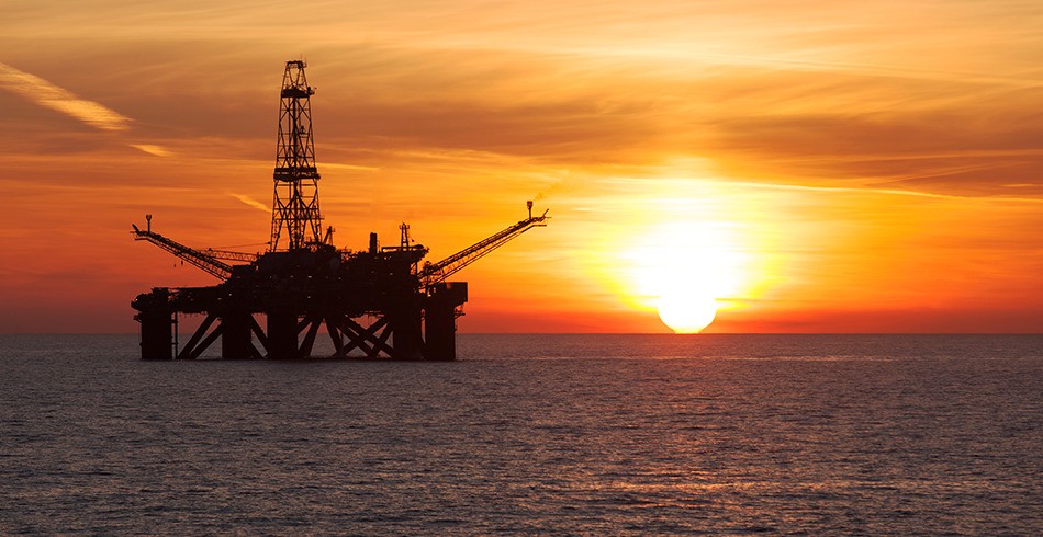 Offshore oil rig with beautiful orange sunset behind it (mexico woodside)