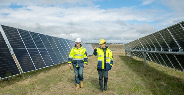 Two ACEN Australia employees walking through the New England Solar Stage 1 project