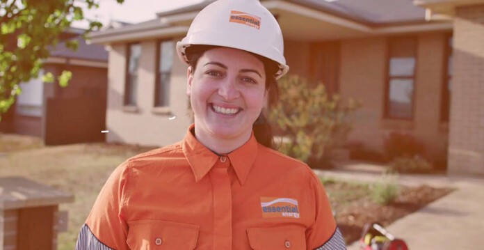 Female Essential Energy employee smiling wearing uniform and hard hat (essential energy)