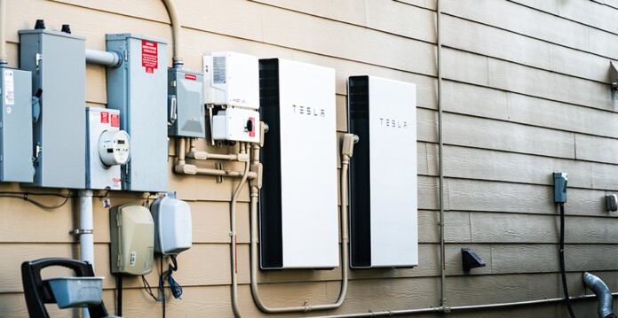 Outside of home with two Tesla Powerwall batteries