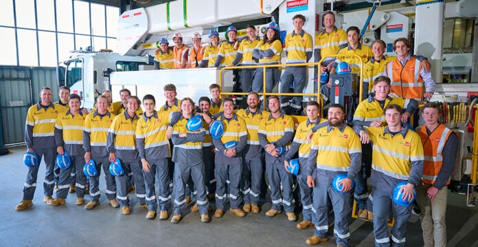Large group of Powercor and Citipower apprentices smile for photo (apprenticeship drive)