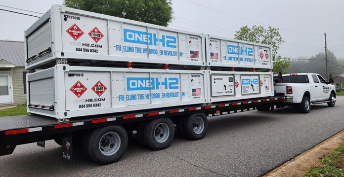 Large hauling truck bearing OneH2 signage on the side (Ampol)