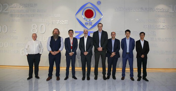 Transgrid and Zhongtian Technology Group executives standing in front of ZTT signage at signing ceremony (equipment)