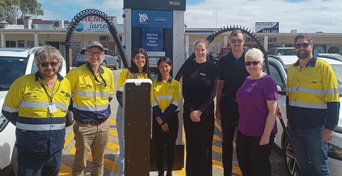 Synergy workers and residents standing in front of EV charger in Jurien Bay, Western Australia