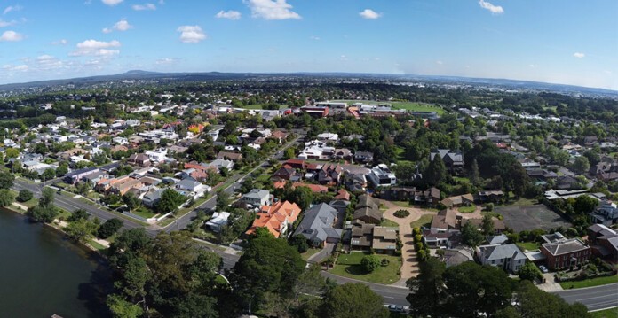 Aerial shot of suburban homes in Ballarat suburb with blue sky overhead